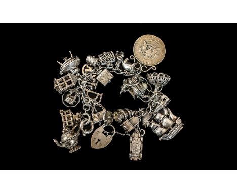 A Superb Vintage Sterling Silver Charm Bracelet Loaded with Over 20 Silver Charms. All Marked for Sterling Silver. Includes A