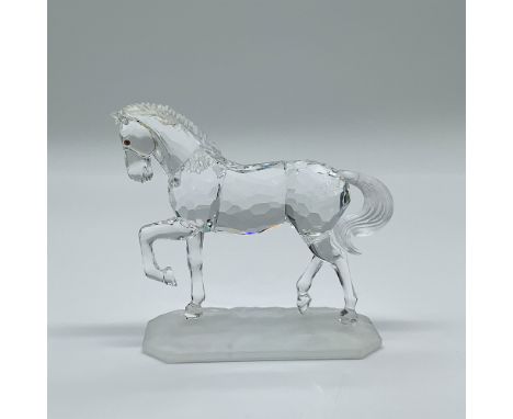 This retired Swarovski crystal figurine, the Arabian Stallion, was part of the renowned “Horses on Parade” collection. Design