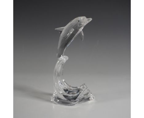 A stunning Swarovski Maxi Dolphin on Wave Base crystal figurine, expertly crafted in precision-cut clear crystal. This dynami
