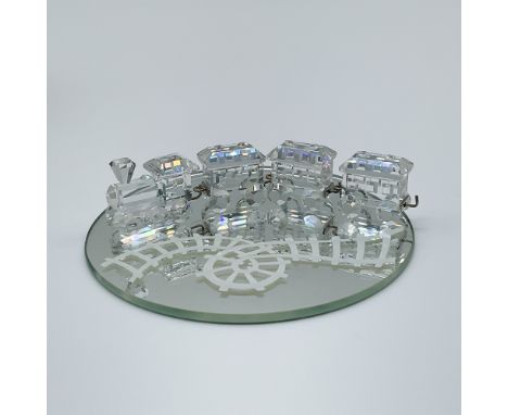 This exquisite Swarovski crystal mini train set, item number 193014, is a stunning miniature creation crafted in clear crysta