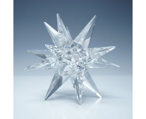 A dazzling Swarovski crystal large star candleholder featuring a multi-faceted design that radiates brilliance from every ang