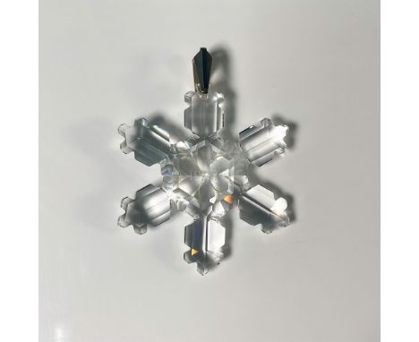 A highly sought-after holiday collectible crafted from the finest Austrian crystal. This intricately faceted snowflake design