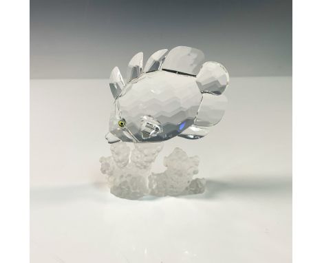 A stunning butterfly fish delicately perched on a coral reef, embodying the elegance and brilliance of marine life. Crafted f