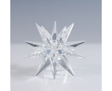 This exquisite Swarovski Silver Crystal star-shaped candleholder features a brilliant multi-faceted design that captures and 
