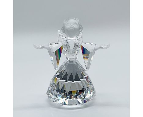 This retired Swarovski crystal angel figurine is crafted from clear crystal, featuring a frosted face and hands, exemplifying