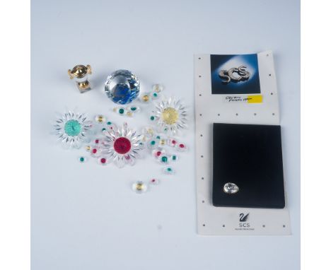This Swarovski crystal collection features seven elegant pieces, each showcasing the brand's renowned craftsmanship and atten