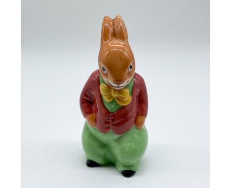 This Royal Doulton Bunnykins figurine, titled Freddie Bunnykins, depicts Freddie in his signature red jacket and green pants.