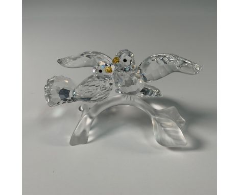Part of the Feathered Beauties collection. This Swarovski crystal figurine features an elegant pair of turtledoves perched on