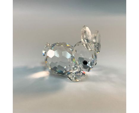Part of the In a Summer Meadow category. This charming Swarovski crystal figurine captures the delicate beauty of a resting r