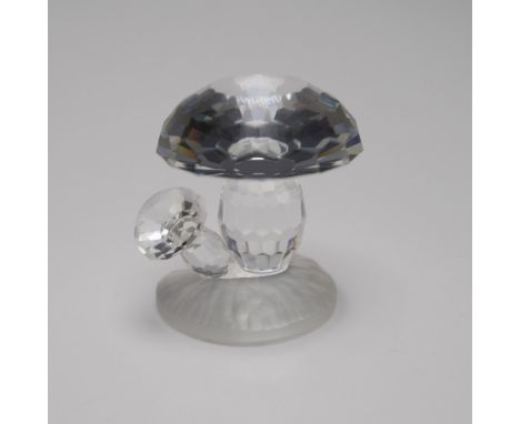 This exquisite mushroom figurine is crafted from clear crystal and rests on a matt crystal base, part of Swarovski's Woodland