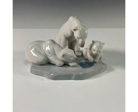 A beautiful Lladro porcelain figurine depicting a serene polar bear family. This charming composition features a mother polar