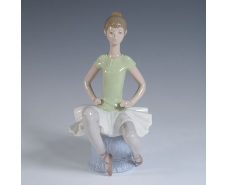 This Lladro porcelain figurine, titled "Laura" (model number 1001360), was sculpted by Juan Huerta and was issued in 1978 and