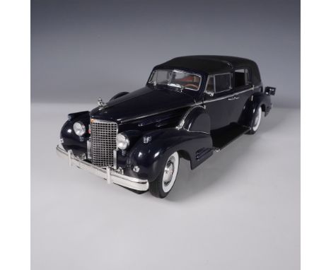This highly detailed 1:18 scale model of a 1938 Cadillac convertible is made by Signature, known for its fine craftsmanship i