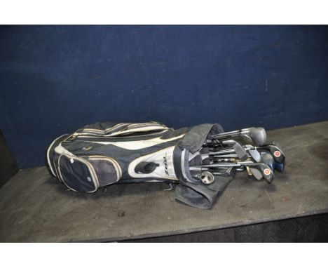 A TAYLOR MADE GOLF BAG CONTAINING ELEVEN DRIVERS by Dunlop, Gowers Brown, Fibreflex, etc, two putter etc