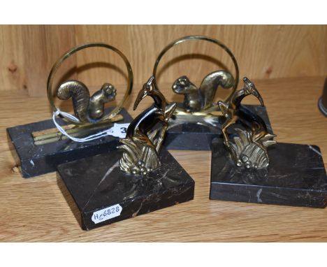 TWO PAIRS OF ART DECO BOOKENDS, comprising a near pair in the form of brass squirrels seated in hoops, the other depicting st