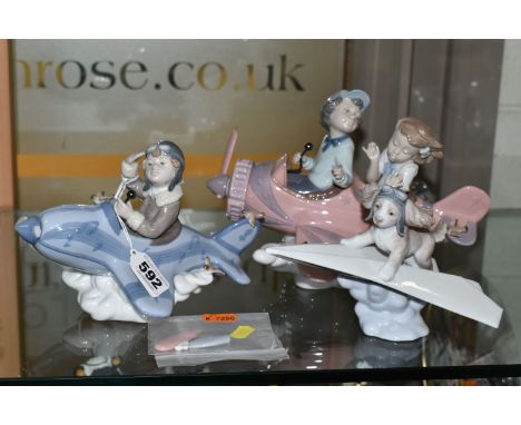A GROUP OF THREE LLADRO FIGURES, comprising   Don't Look down  , No.5698, depicting a boy and girl in a propeller plane, 16.5