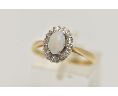 AN 18CT GOLD OPAL AND DIAMOND CLUSTER RING, oval cluster set with a central opal cabochon, in a surround of single cut diamon