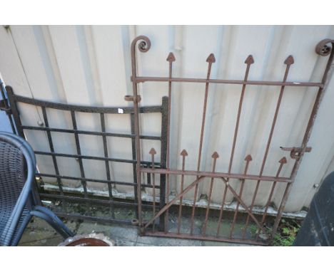 AN ANTIQUE WROUGHT IRON SINGLE GATE, 86cm x 93cm along with wrought iron spoked gate, 80cm x 119cm (2)