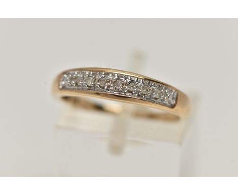 A 9CT GOLD DIAMOND SET RING, designed as a row of seven single cut diamonds to the plain tapered band, with 9ct hallmark for 