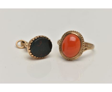 A 9CT GOLD CABOCHON RING AND FOB SEAL, the ring set with an oval carnelian cabochon collet set with a fine rope twist surroun