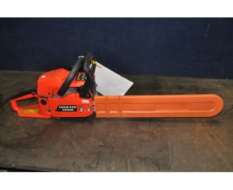 AN UNBRANDED PETROL CHAINSAW with guard covering a 21in blade (engine pulls freely but hasn’t started)