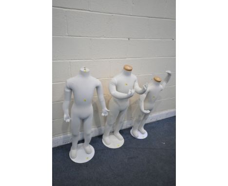 THREE ARTICULATED CHILDREN SHOP DISPLAY MANNEQUINS, on a separate metal base, max height 106cm (condition report: -one manneq