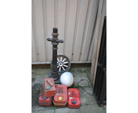 A PAINTED CAST IRON LANTERN, with a later plastic shade, height 111cm, along with four petrol cans, and a cart wheel (conditi