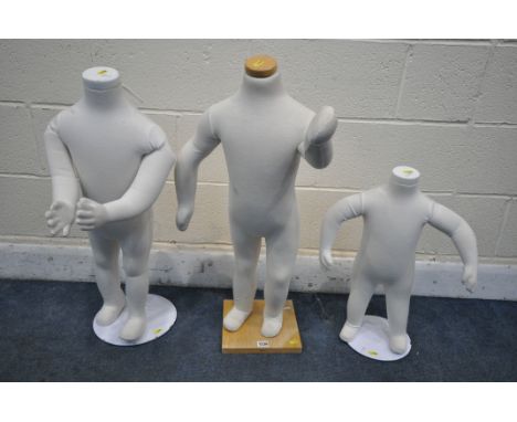 THREE ARTICULATED TODDLER SHOP DISPLAY MANNEQUINS, on a separate metal base, max height 106cm (condition report: -one mannequ