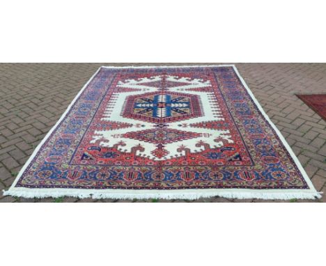 A Persian Viss carpet, with geometric motifs on a white ground, 319 x 222 cm