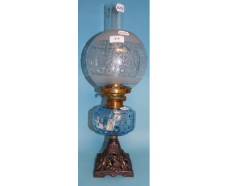 A Victorian oil lamp, with blue glass reservoir, and etched glass shade, 52 cm high