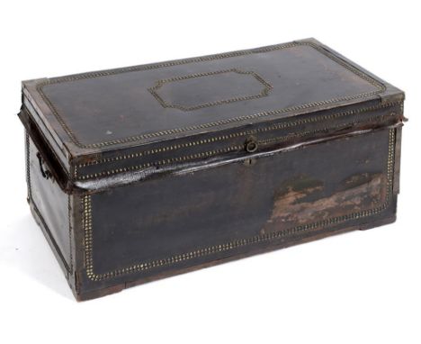 A 19th century leather mounted travelling trunk, with brass studwork decoration, 92 cm wide  See illustration