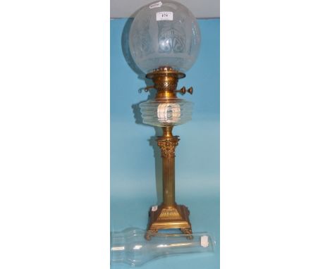 A Victorian oil lamp, with Corinthian column, clear glass reservoir and etched glass shade, 71 cm high