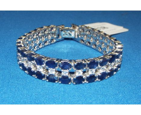 A silver and sapphire line bracelet Condition report Report by NG

Modern item. Stamped 925. Stones are very poor quality. Un