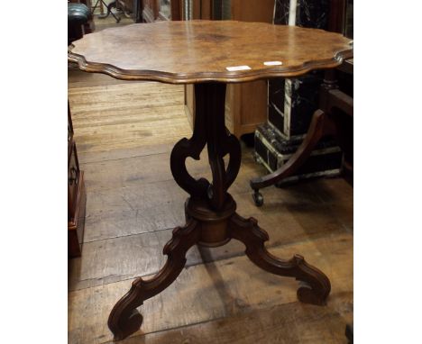 A Victorian tripod table, the shaped circular top veneered in burr walnut, 66 cm diameter