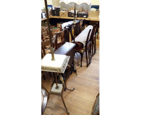 A brass and onyx standard lamp, another similar, a set of four mahogany parlour chairs, and a carved oak gateleg table (7)