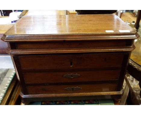A 19th century French box, in the form of a commode chest of drawers, on bun feet, 55 cm wide