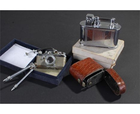 Lumix novelty Camera lighter, with stand, together with Lancel lighter and another lighter, (3)