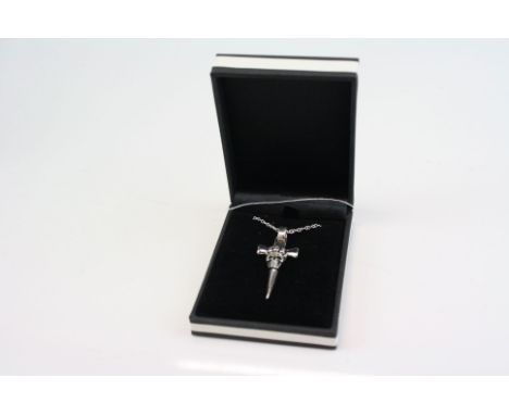 A unusual silver crucifix with a skull adornment. 