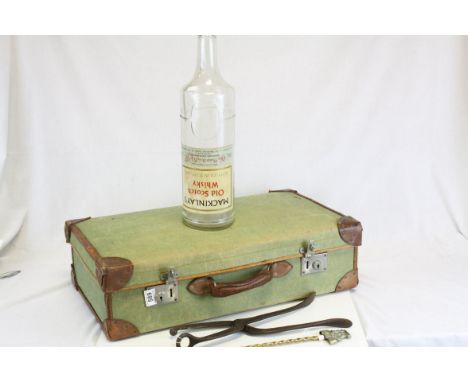 Vintage Canvas and Leather Suitcase together with an empty 6 pint Bottle of Mackinley's Old Scotch Whiskey and two Fire Imple