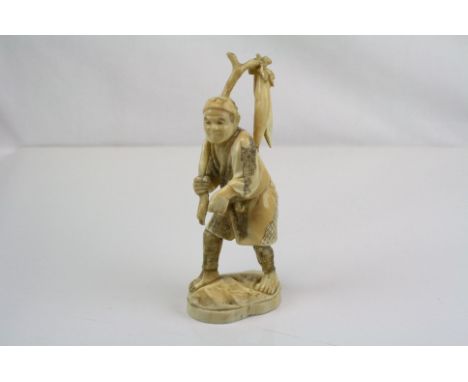 Japanese carved ivory figure of a farmer carrying vegetables on a stick , signed within a red lacquer tablet underneath, h:16