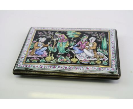 A vintage cigarette case with enamel decoration.