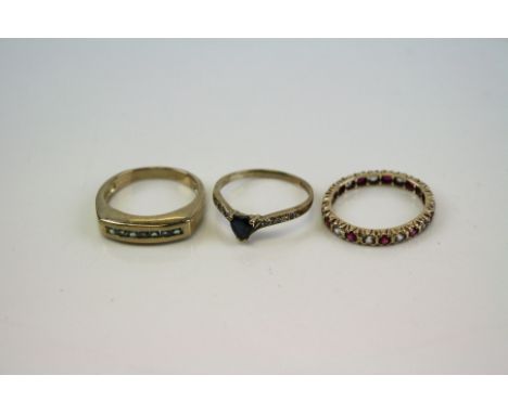 Three ladies 9ct Gold and gemstone rings to include a full eternity ring.