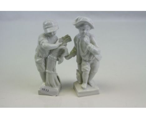 A pair of blanc de chine ceramic figures depicting young boys.