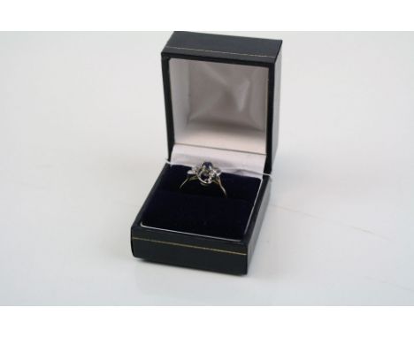 A Y/G sapphire and diamond cluster ring.