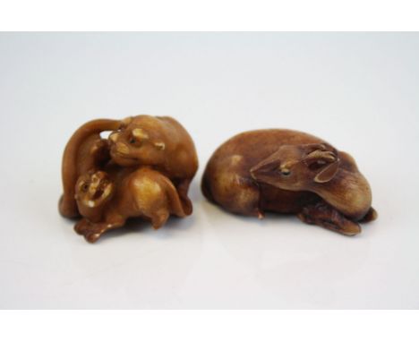 Netsuke  of a recumbent deer and another of a lioness and cub (2)