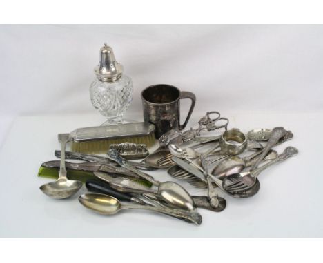 A collection of silver and silver plated items to include napkin ring, sugar shaker and wick trimmers.