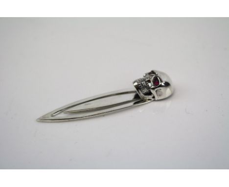 A silver skull bookmark 