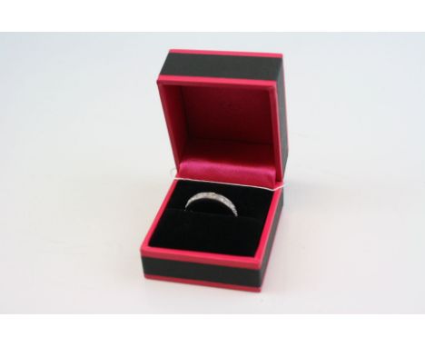 A 9 CT W/G Diamond full eternity ring.