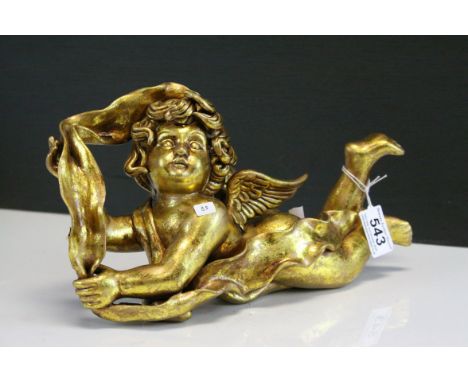 Ceramic Gilt recumbent Cherub Figure in leaf.