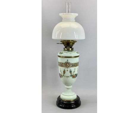 VICTORIAN GREEN OPAQUE GLASS OIL LAMP with paint enamelled decoration of swags and flowers, on circular black ceramic base, H